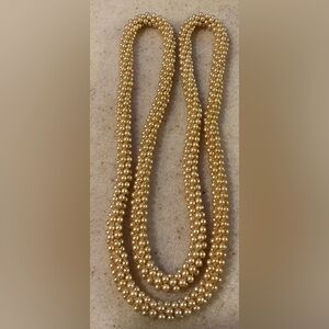 Luxurious Gold Textured Necklace with Intricate Beading